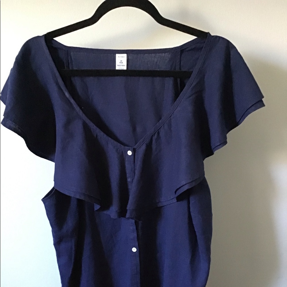 Ruffled neck button up top in navy blue.